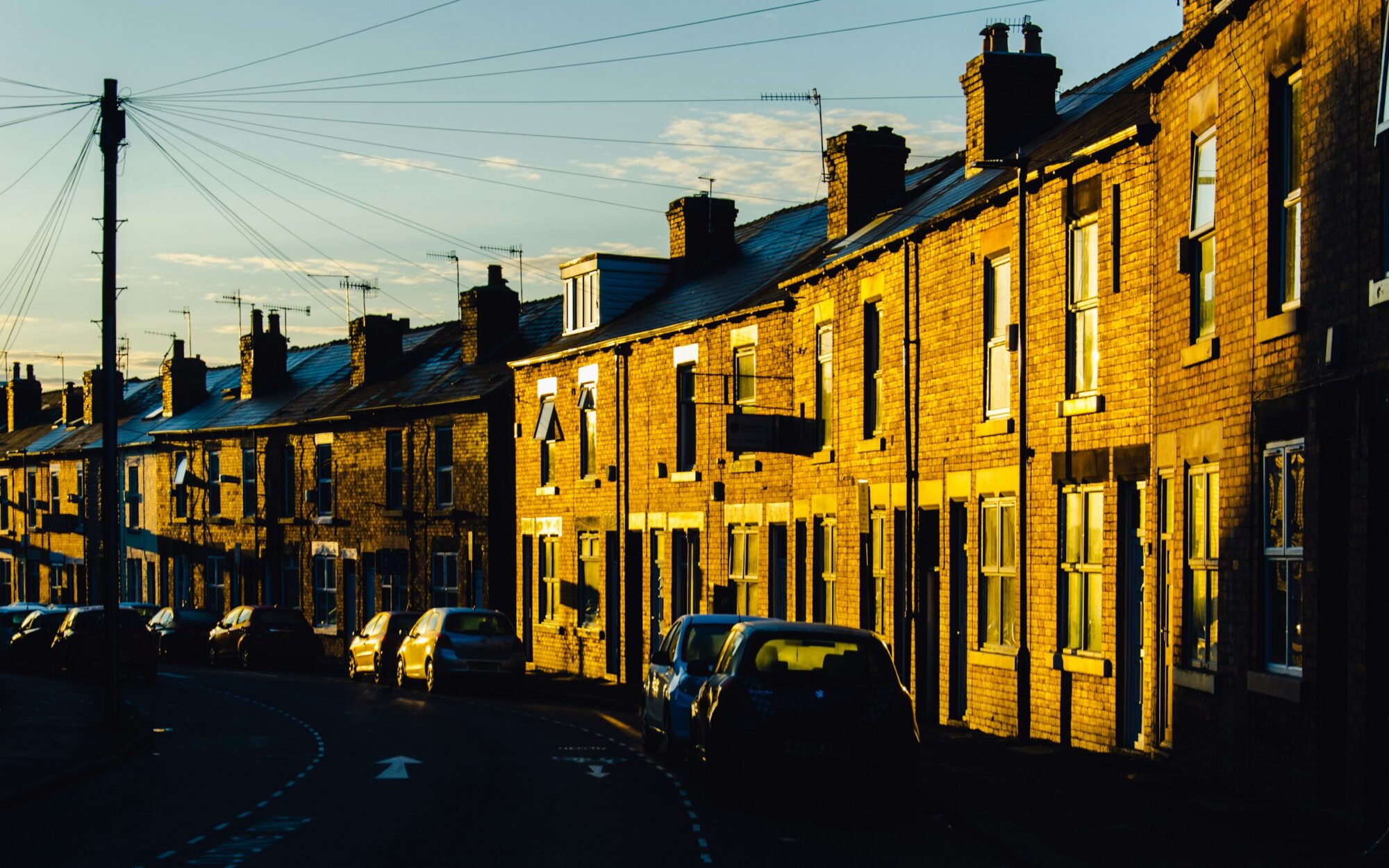 Light from Sunrise hitting red brick terraced houses on Neill Road, in Hunter’s Bar, Sheffield.