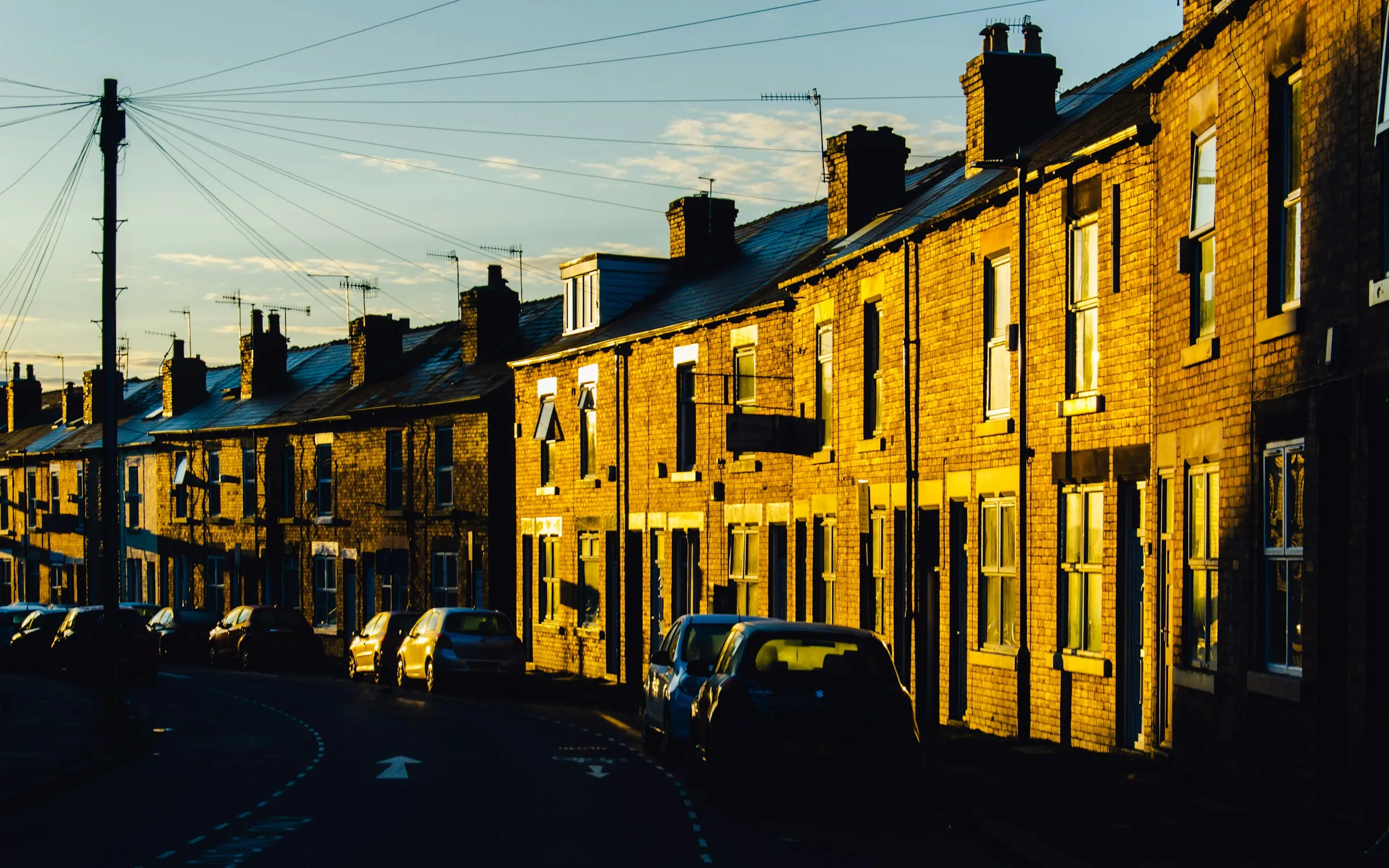 Light from Sunrise hitting red brick terraced houses on Neill Road, in Hunter’s Bar, Sheffield.