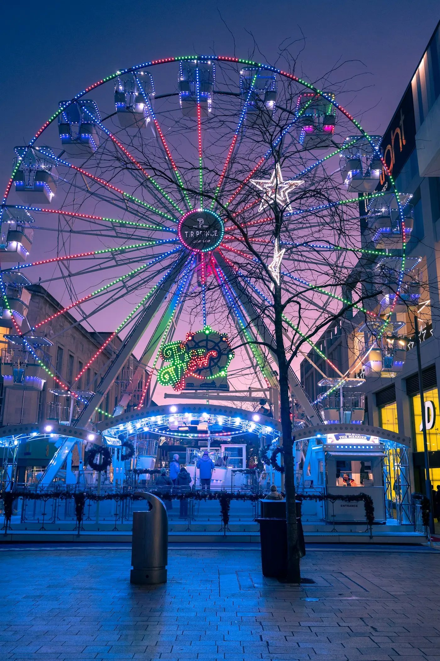 The illuminated big wheel in Sheffield city centre at night